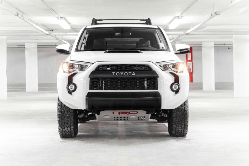 a white truck parked in a parking garage