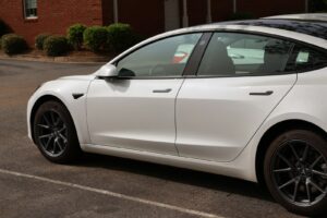 a white car parked in a parking lot