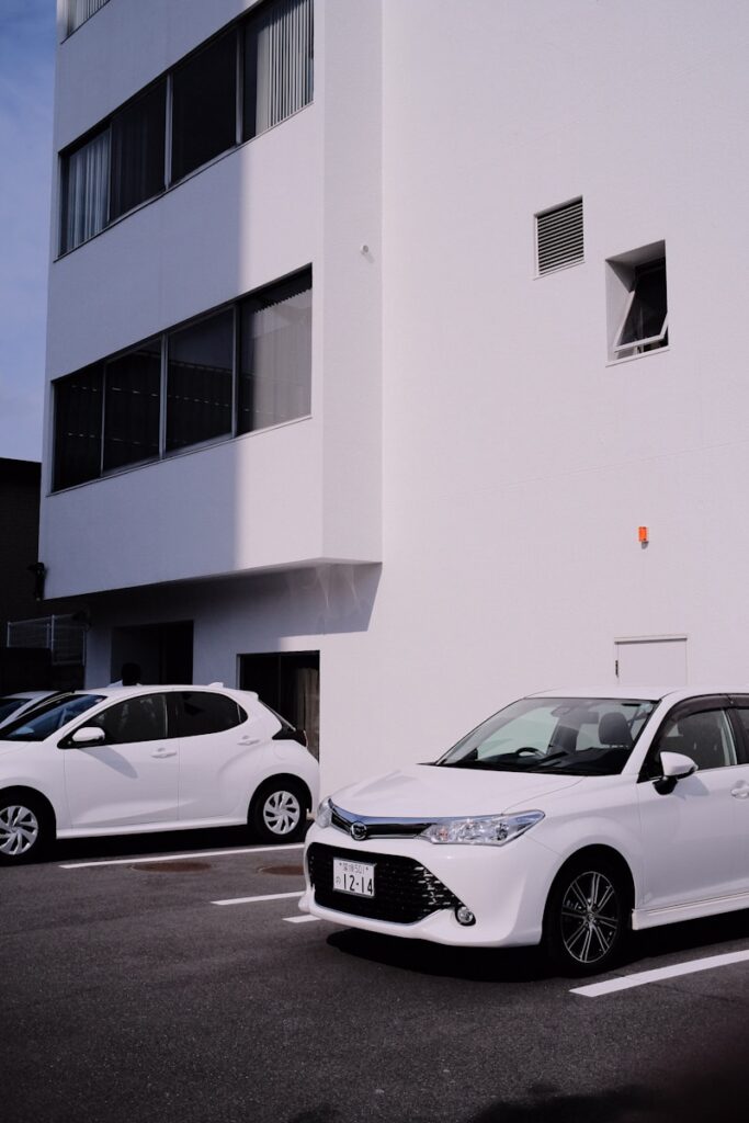 a couple of cars parked outside a building